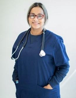 Nursing student in scrubs with stethoscope 